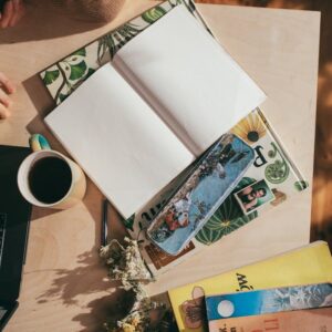 Woman at table with empty planner and coffee