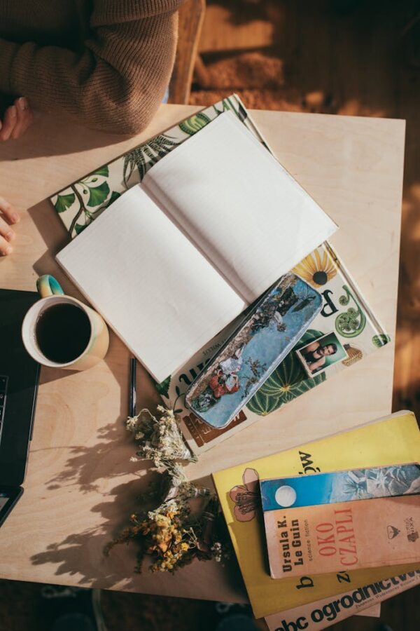 Woman at table with empty planner and coffee